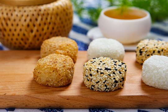 Assorted glutinous rice mochi coconut sesame coated square ceramic plate