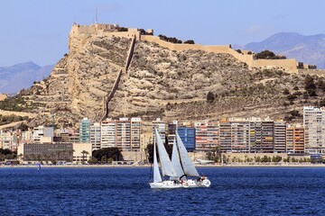 Sailboats sailing near the Mediterranean city of Alicante, Spain. © Jose Lledo