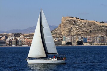 Sailboats sailing near the Mediterranean city of Alicante, Spain. © Jose Lledo