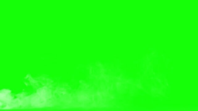 Smoke plumes drift gently across the lower frame against a bright green screen background, providing a versatile visual effect for compositing fire, steam, or atmospheric conditions in digital.