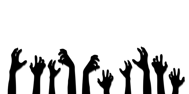 Silhouette of zombie hands reaching up