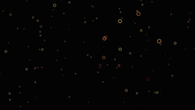 A multitude of small, hollow circles and a few larger, solid spheres in yellow, orange, and red hues scattered across a deep black background, creating a subtle