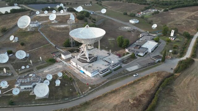 Aerial view of satellite dish antennas at a rural ground station