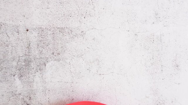 Hands hold a red speech bubble cutout