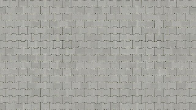Grey concrete interlocking pavers create a seamless loop pattern.