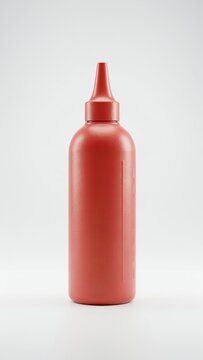 Red plastic ketchup squeeze bottle