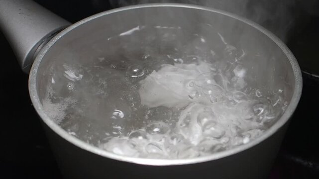 Boiling water in a pot on the stove