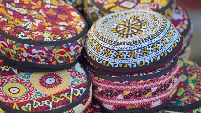 Colorful hats are stacked at a market in Morocco