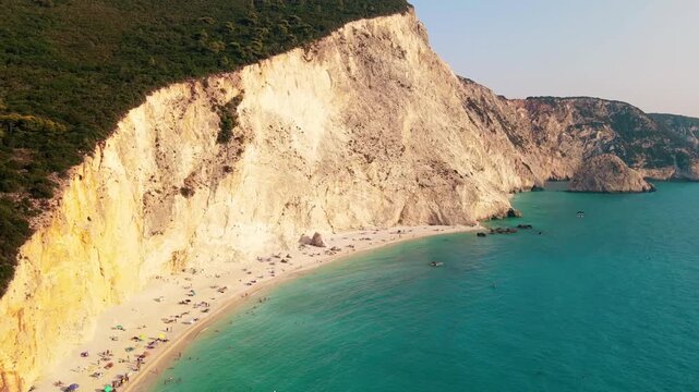 Porto katsiki beach aerial view with white cliffs and turquoise water in lefkada island greece motion.
