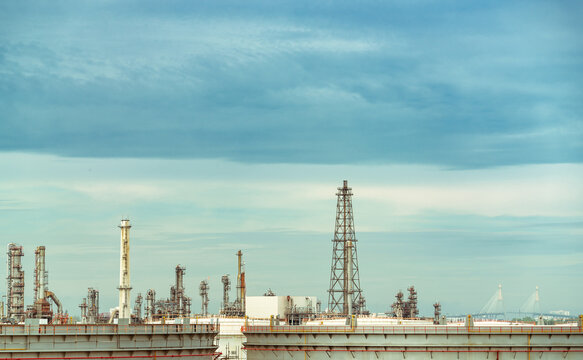 Oil refinery or petroleum refinery plant. Power and energy industry. Oil and gas production plant. Petrochemical plant. Chemical pipeline. Natural gas storage tank with sky. Petroleum engineering.