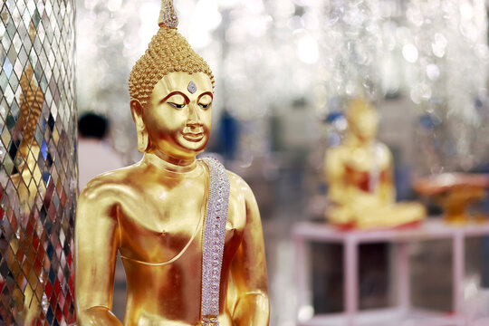 Golden Buddha statue inside a Buddhist temple. Elegant sacred architecture symbolizing peace, faith, spirituality, and Asian culture, ideal for travel, religion, and cultural projects