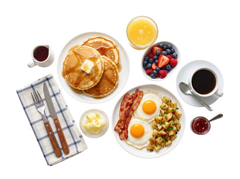 Delicious breakfast set with pancakes eggs bacon potatoes berries and coffee transparent background