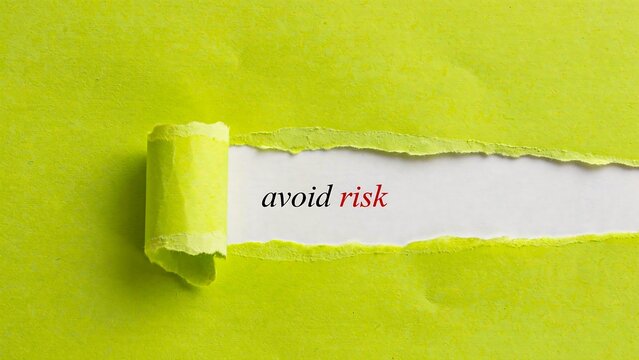 Avoid risk business concept revealed through torn paper background