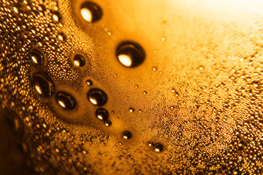 Water Condensation Droplets Close Up in Low Key Warm Yellow Light