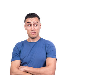 Obraz premium Man with his arms crossed looking aside with distrust