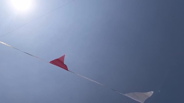 Red and White Bunting Flags Hanging Along Street for Indonesian Independence Day