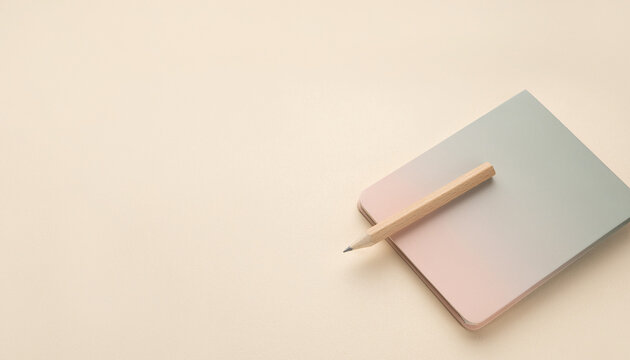 Back to School flat lay concept with a sleek modern notebook and a wooden pencil on a clean minimal background

