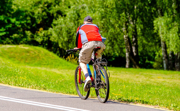 Cyclist ride on the bike path in the city Park
