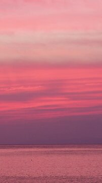 Beautiful Pink Sunset over the Ocean with Calm Sea and Colorful Evening Sky, Japan Nature Landscape, 4K Video vertical