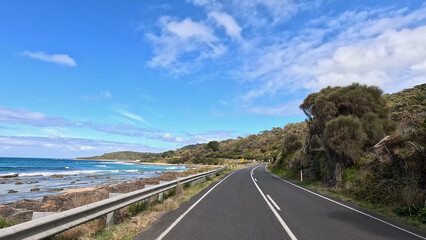 Fototapeta premium Winding Asphalt Road Along the Great Ocean Road Coastline