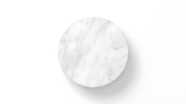 White marble circular podium on a plain background.