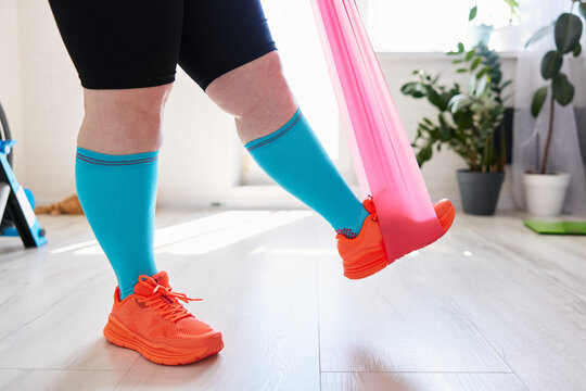 Exercising with resistance band at home training