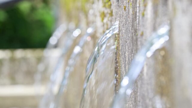 Natural Spring Water Flowing from Stone Fountain, Clear Fresh Water, Relaxing Nature Background, 4K Video