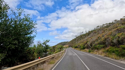 Obraz premium Winding Asphalt Road Along the Great Ocean Road in Victoria Australia