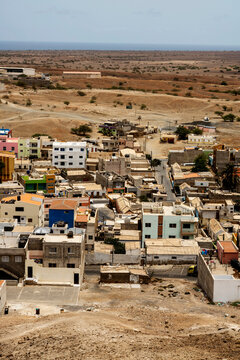 Colorful coastal village in a dry desert landscape