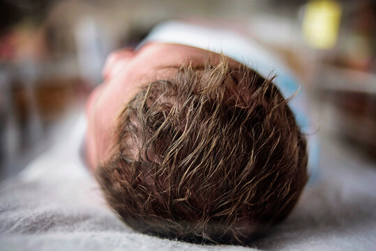 Close up on a newborn baby's head of hair