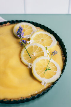 Fresh lemon tart decorated with lavender flowers