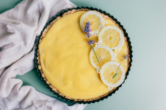 Homemade lemon curd tart with lavender garnish