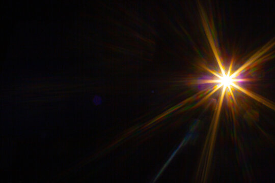 Sun flare on the black background