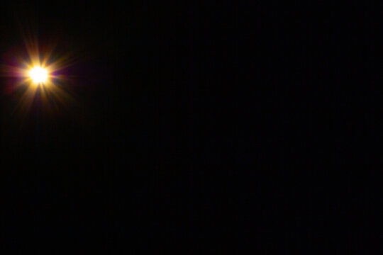Sun flare on the black background