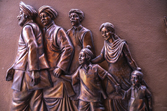 Bas-relief sculpture at Jallianwala Bagh, Amritsar, India, depicting a family in traditional clothing
