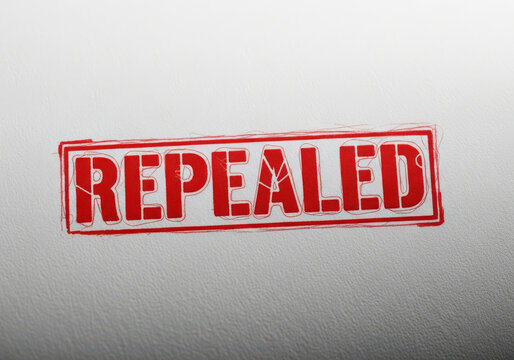 Red rubber ink stamp with the word repealed written in bold capital letters