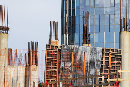 Construction site with steel rebar and concrete pillars