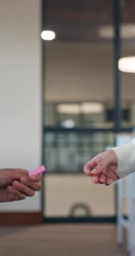 Student, hands and passing with crib note for cheating exam, message or secret in classroom. People, academic learners or private information in test or assessment for answer, gossip or question