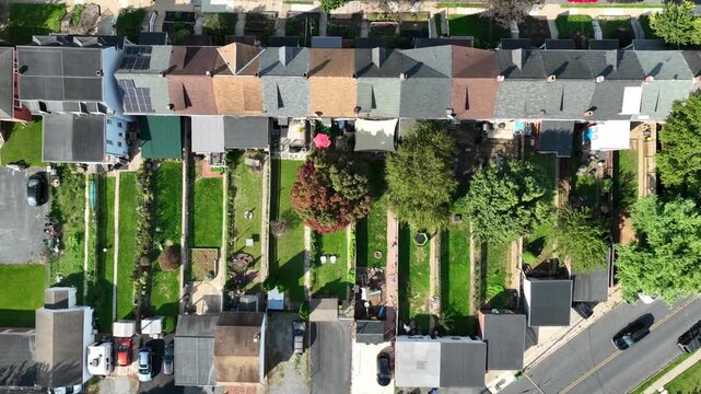 Aerial view of residential neighborhood with green lawns