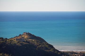 Fototapeta premium views with old castle ruins with the Thyrrhenian sea in the background, Maierà, Cosenza