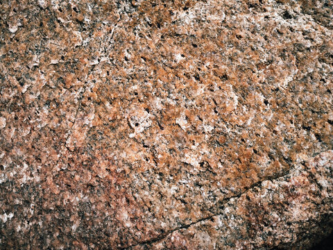 Natural light brown rock background. Stone texture. Grunge granite surface.