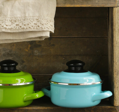 metal pots cookware on a wooden, domestic kitchen