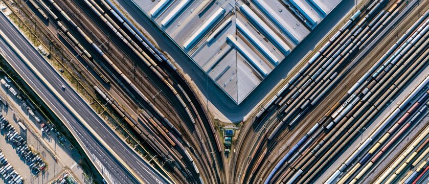 Complex train yard layout with tracks and buildings shown from above