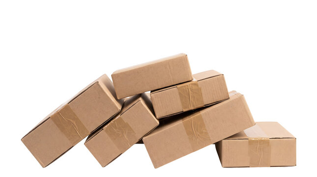 Stack of brown cardboard boxes sealed with adhesive packing tape arranged in a messy pile for shipping on transparent background