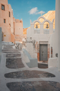 Cycladic architecture and whitewashed walls create a charming scene on a sunny day