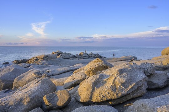 Rock formations in the evening light on, Capo Sant Andrea, Marciana, Livorno Province, Italy