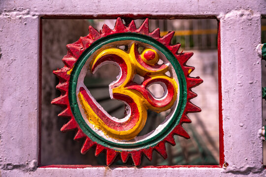 Colorful Hindu Om symbol, a traditional decoration in Dharamsala, Himachal Pradesh.