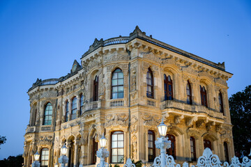 Obraz premium Küçüksu Pavilion facade, Istanbul. Exquisite Ottoman architecture, intricate Baroque stonework, windows, clear blue sky. Travel, history background.
