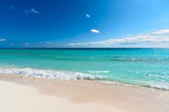 Beautiful beach and waves of Caribean Sea in Riviera Maya, Mexico
