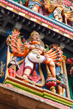 Scene featuring sculptures on Hindu temple gopura (tower). Menakshi Temple, Madurai, Tamil Nadu, India